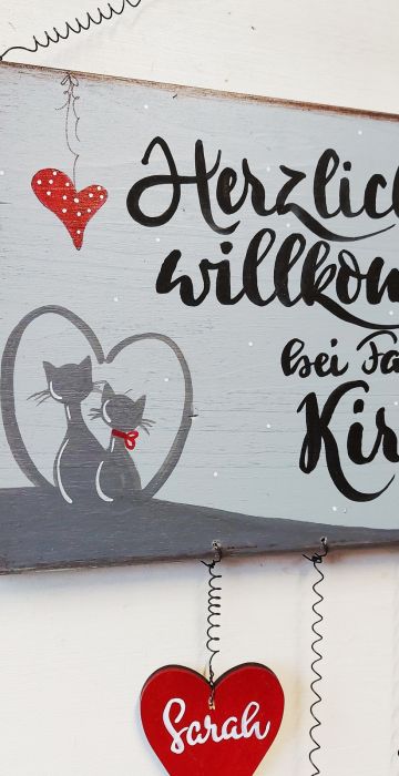 Türschild mit einem Katzenpaar